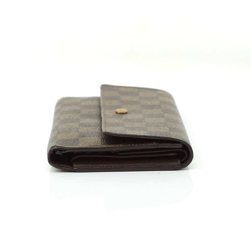 Pre-loved authentic Louis Vuitton Porte Tresor sale at jebwa.