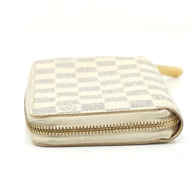 Pre-loved authentic Louis Vuitton Zippy Wallet White sale at jebwa