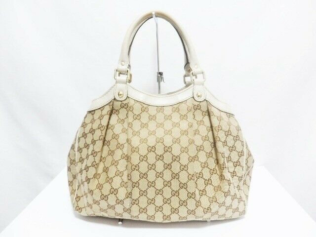 Pre-loved authentic Gucci Gg Sukey Beige Brown White sale at jebwa