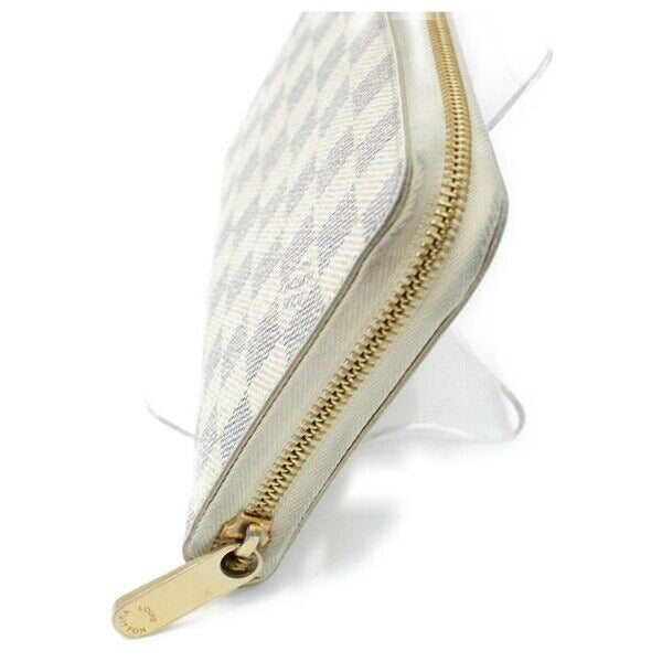 Pre-loved authentic Louis Vuitton Zippy Wallet White sale at jebwa