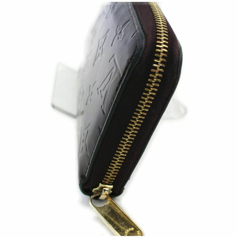 Pre-loved authentic Louis Vuitton Zippy Wallet Amarante sale at jebwa