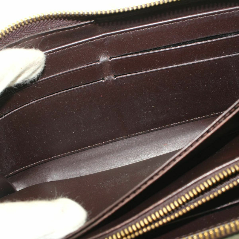 Pre-loved authentic Louis Vuitton Zippy Wallet Amarante sale at jebwa