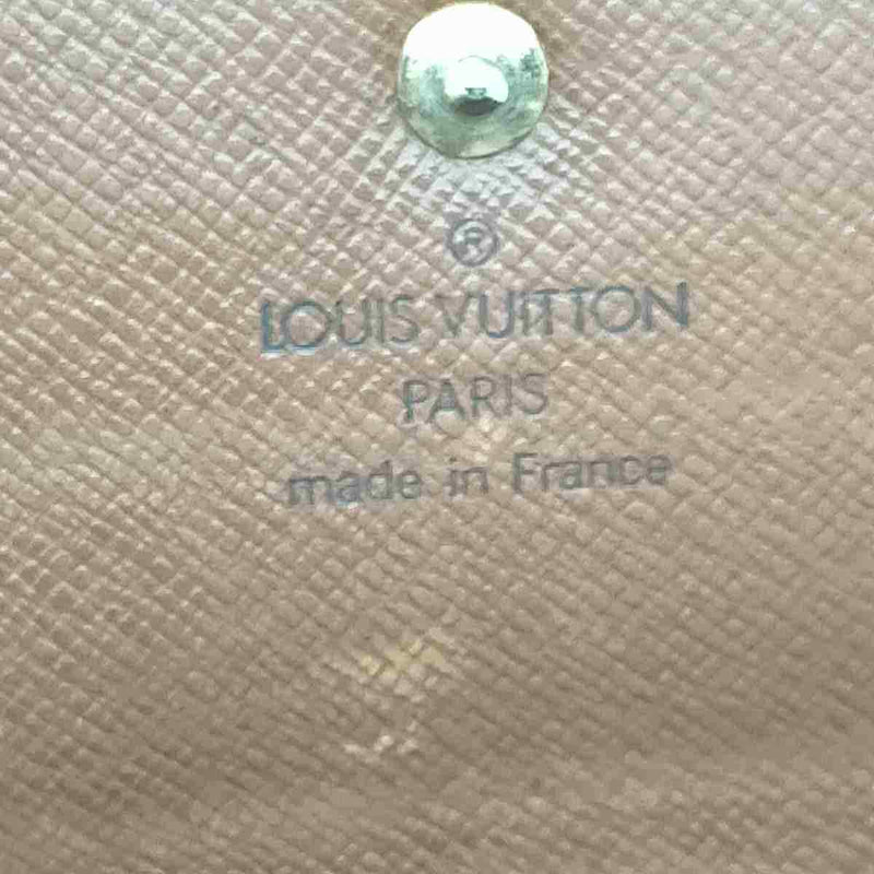 Pre-loved authentic Louis Vuitton Pochette Monnaie sale at jebwa.