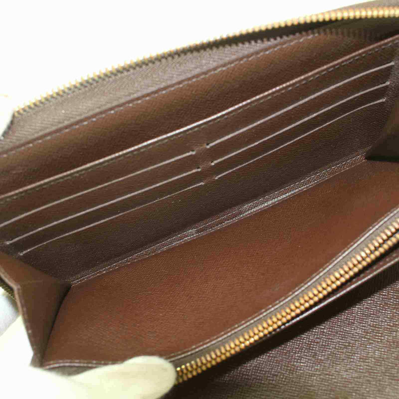 Pre-loved authentic Louis Vuitton Zippy Wallet Brown sale at jebwa.