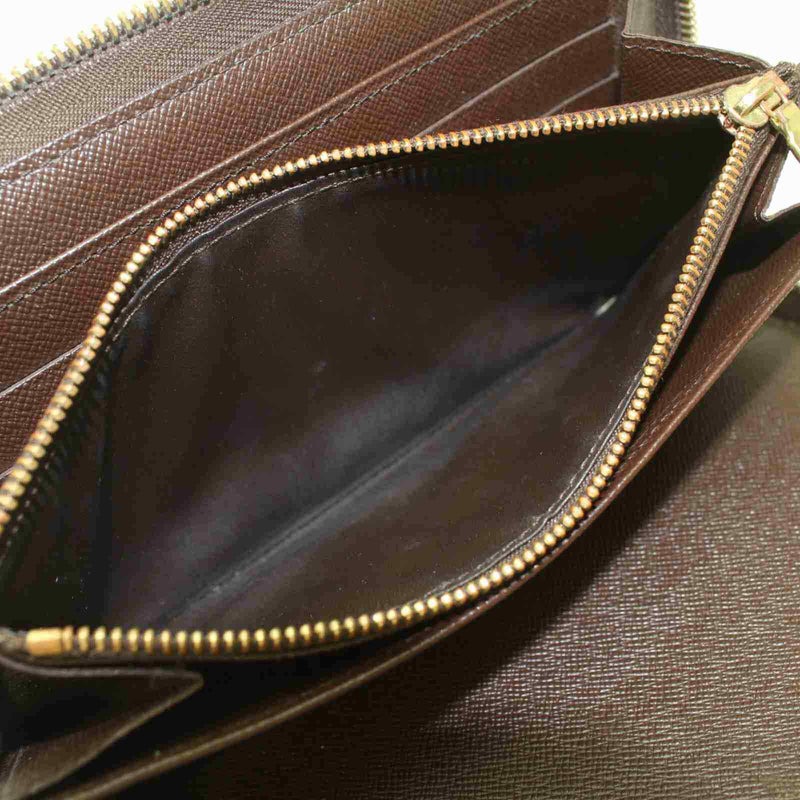 Pre-loved authentic Louis Vuitton Zippy Wallet Brown sale at jebwa.