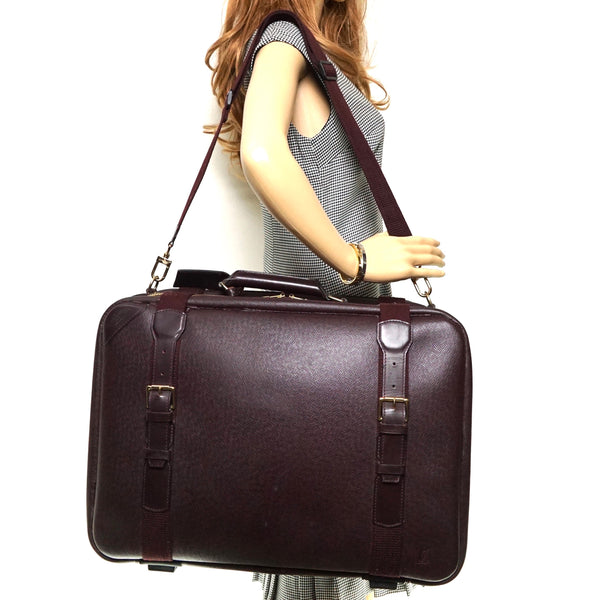 Pre-loved authentic Louis Vuitton Taiga Mitka Travel sale at jebwa