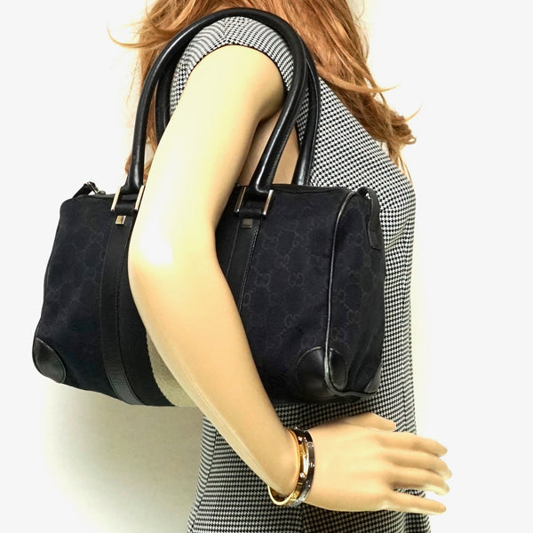 Pre-loved authentic Gucci Hand Bag Black Canvas sale at jebwa